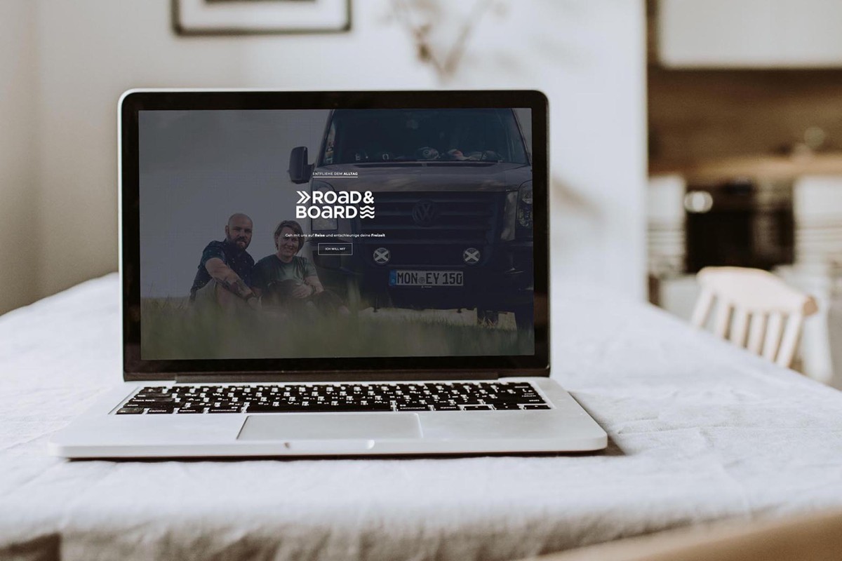 Blank screen laptop. Home office desk table workspace. Modern nordic interior design template.